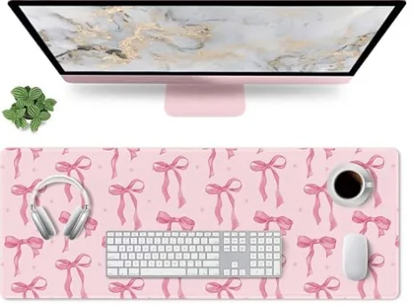 Dark pink bow-print desk mat with stitched edges